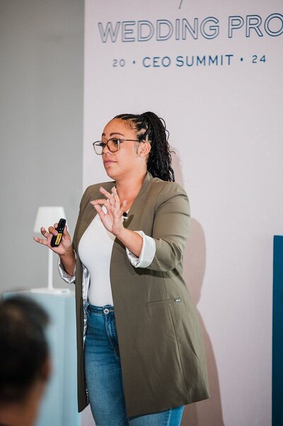 Speaker on stage at  wedding industry conference