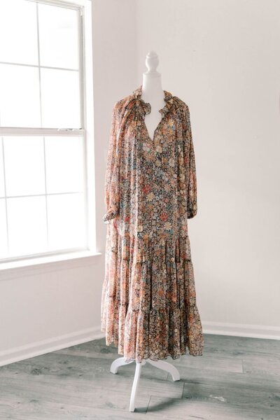 Women's brown, orange and red floral pattern, long sleeve dress.