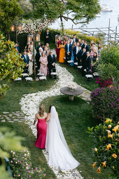 Elegant Amalfi Coast wedding portraits surrounded by bougainvillea and Mediterranean charm
