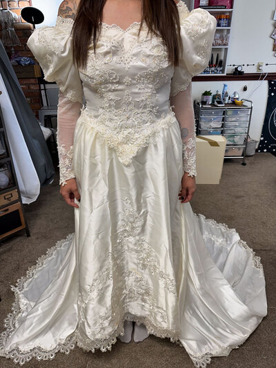 Vintage wedding dress with lace details and puffed sleeves