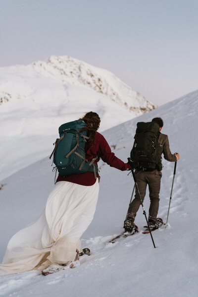 Couple snowshoeing on their elopement day in Innsbruck Austria