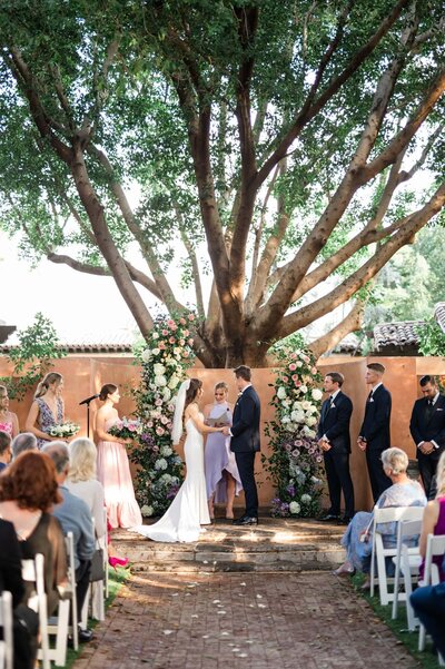 Wedding ceremony in the Alegria Garden at the Royal Palms wedding venue