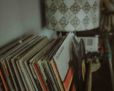 A nostalgic and artistic collection of vinyl records, capturing the timeless charm of analog music and vintage style