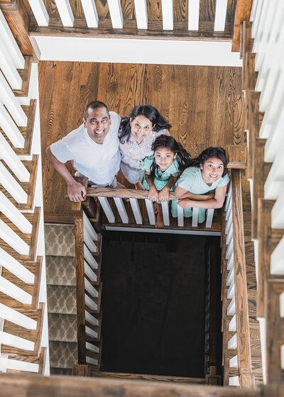 Photo of family on grand staircase at their NJ home