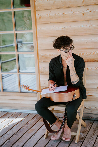 Writing vows on guitar in Dolomites