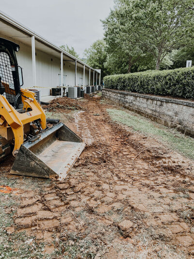 excavator-preparing-backyard-for-french-drains