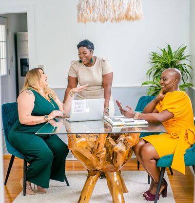 branding session for realtors Columbia sc two black women one Hispanic woman laughing and talking