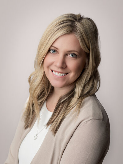 Female headshot sitting on couch in medina studio