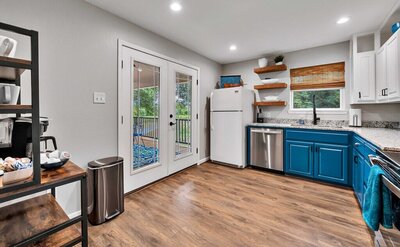 Kitchen with patio access in this 2-bedroom, 2-bathroom bungalow outside Waco, TX