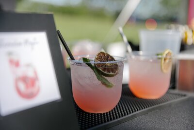 Pink cocktails with garnish served from Bee Tapped Dry Bar beverage truck for parties