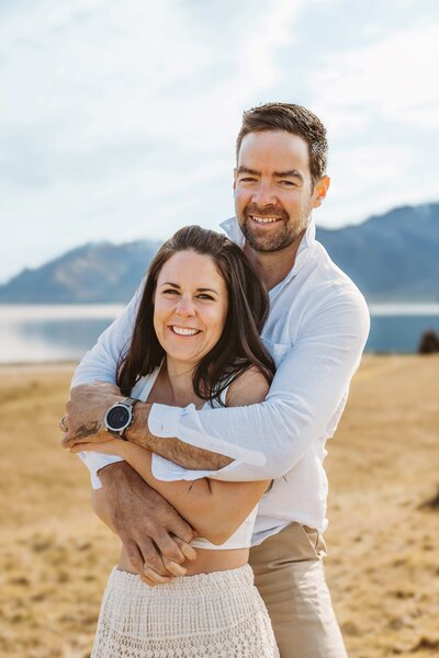 couple hugging during an engagement photography session in wanaka with Captured by Bie