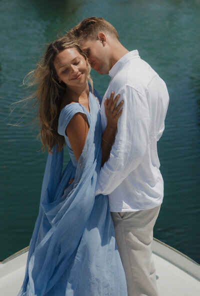 Cinematic Marin County couples photography on a boat. Romantic, fashion-forward editorial photography.