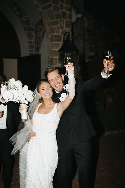 bride and groom giving a toast