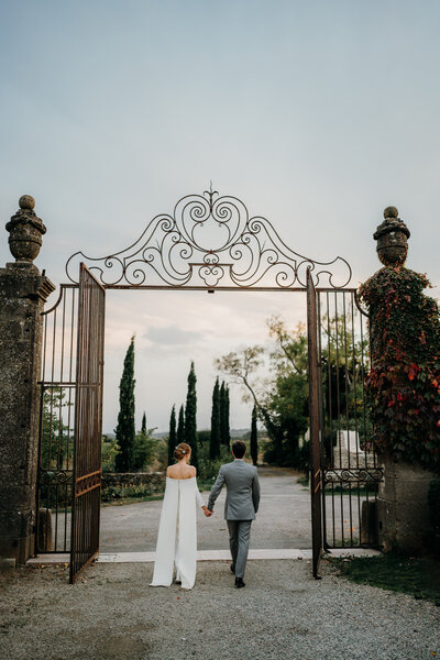 couple walking away holding hands in cinematic photograph