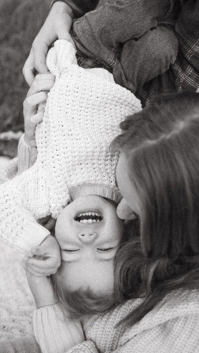 Mom kisses on her toddler.