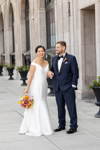 A bride and groom kissing each other