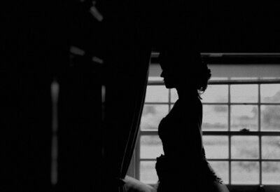 Silhouette of a bride at the Cliff at Lyons after putting on her wedding dress, captured by Organic Love Story.