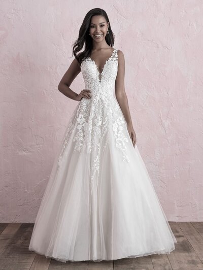 With swirling appliqués and a gorgeous train, this strapless crepe gown is truly stunning.