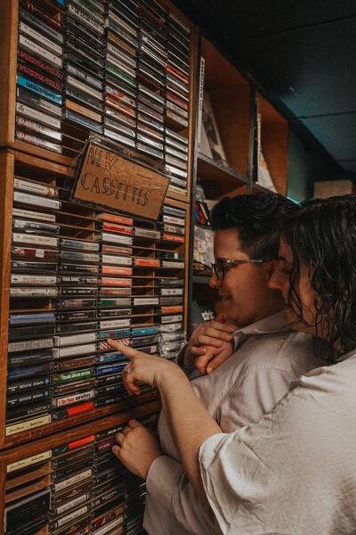 Two people look at cassettes in a Nashville record store