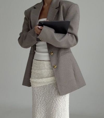 Aesthetic, professional woman who is a mom managing her busy schedule with a iPad tablet and Notion planner for seamless organization