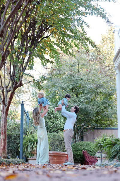 ms-family-holding-kids-in-air