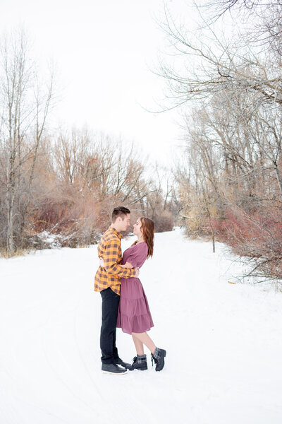 Seattle Wedding Photographer Investment Packages with couple standing together in snowy meadow