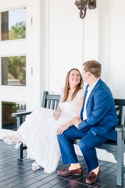 Engaged Couple Sitting on Bench by  by Alabama Wedding Photographer Amanda Horne