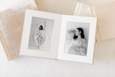 An open heirloom album with 2 black and white boudoir images by Indianapolis boudoir photographer, Brittney Lear
