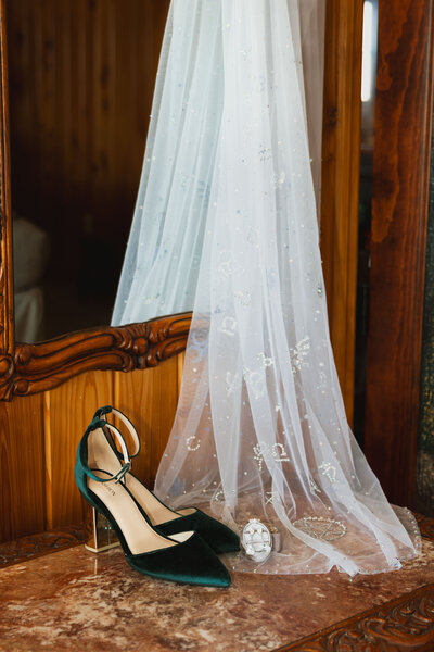Florida Wedding Photographer and Videographer wedding day details green shoes and custom vail