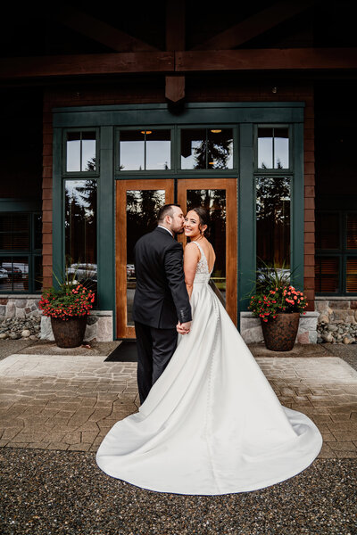 a bride and groom hugging after an emotional first look