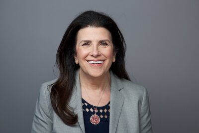professional headshot with woman smiling