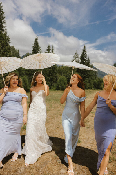 editorial bridesmaids with umbrellas in seattle