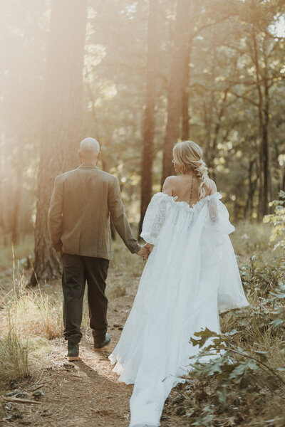 dreamy photo of bride and groom in forest