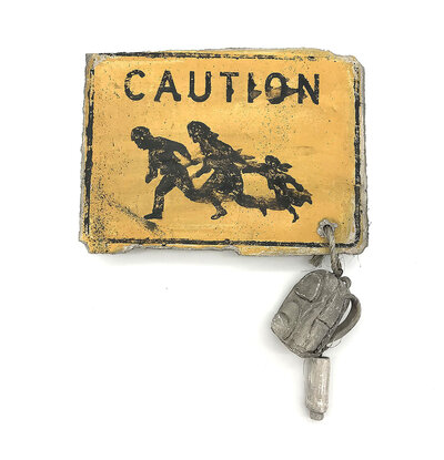 A ceramic yellow caution sign with imagery of a family running and a ceramic backpack and water bottle hanging off of it