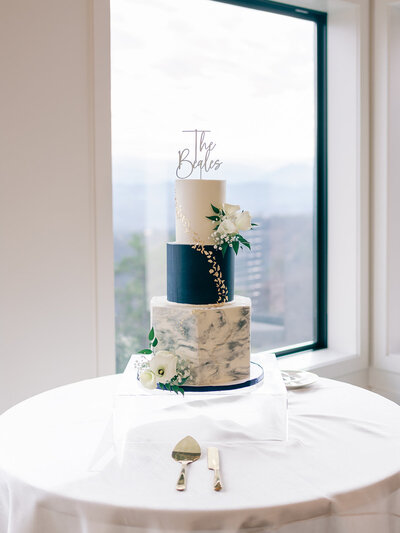 Three tier marble and navy wedding cake for a wedding at Trillium