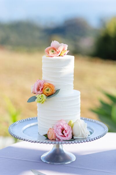 wedding cake with colorful flowers