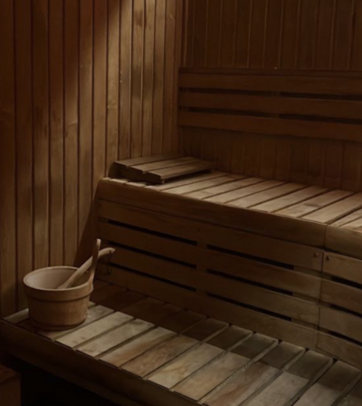 A white flower floating in a aqua pool. 