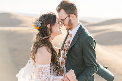 two brides holding hands during their wedding ceremony in sacramento.