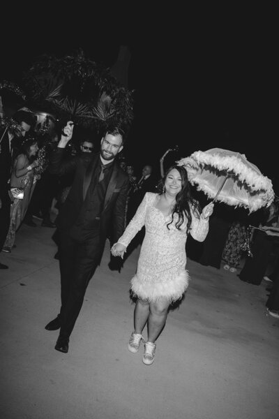 Black-and-white newlywed exit second line, coordinated by Westmore Events in Houston.