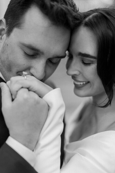Man kisses wife's hand while eloping in New York City