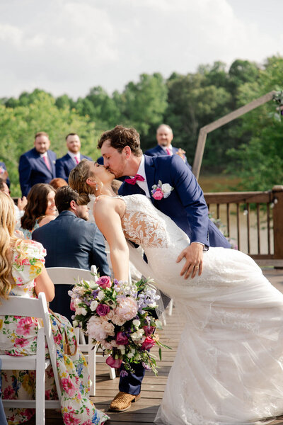 bride and groom kissing at ceremony atlanta wedding venue