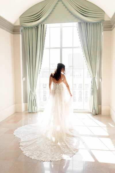 Elegant bridal portrait captured by Style & Grace Photography in St. Louis, MO, featuring the bride in a stunning lace wedding dress, highlighting her beauty and grace on her special day.