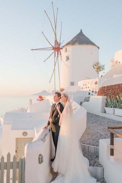 bride-and-groom-in-front-of-wedding-car-