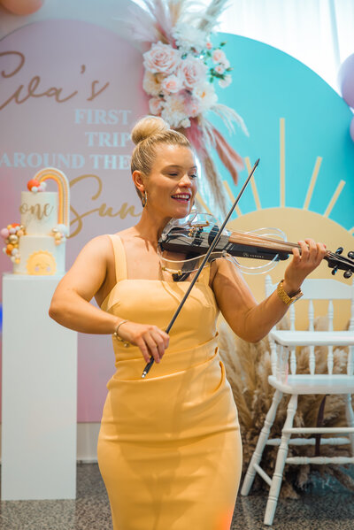 vocalist and guitarist performing a wedding ceremony at dunes palm beach in Sydney.