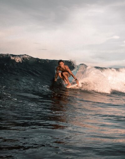 longboard surfer hanging 10