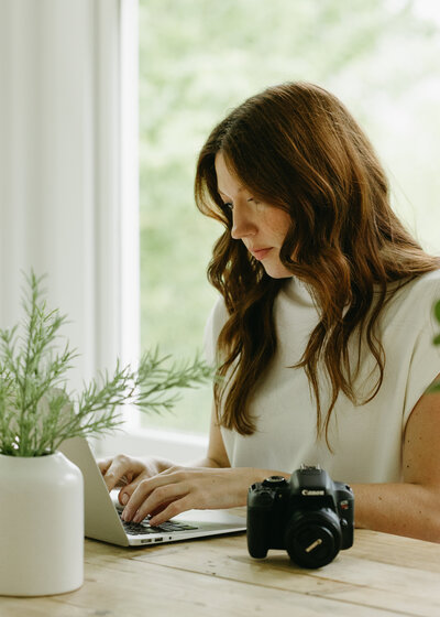 Marie-Catherine working on her laptop