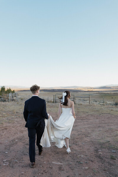 Bride and groom are posing for their portraits during their intimate elopement in northern Colorado. Captured by a Minnesota based wedding and elopement photographer.