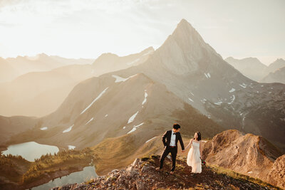 wedding couple hiking up a mountain in kananaskis