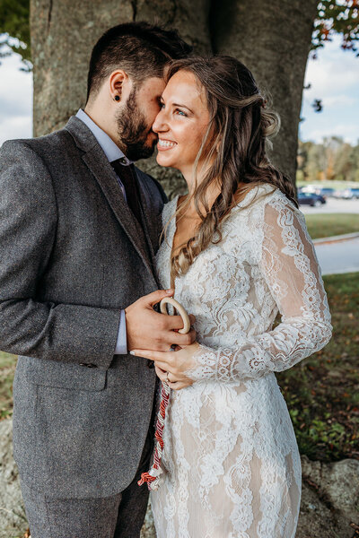 Groom whispers in his bride's ear