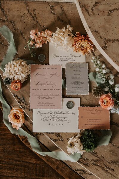 modern wedding invitation with soft, romantic hues and calligraphy